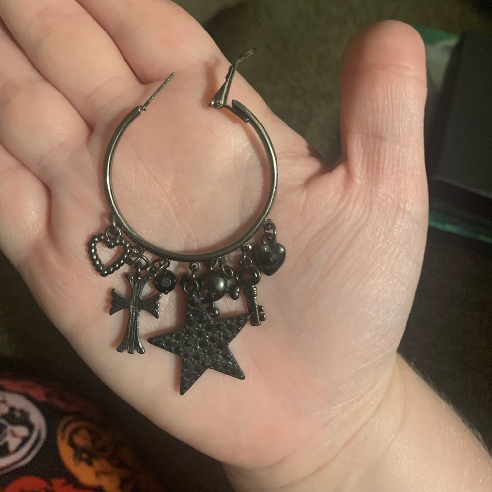 black hoop earrings with charms: skull, cross, key, hearts